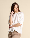 Blusa in mussola di cotone goffrato