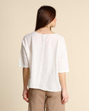 Blusa in mussola di cotone goffrato