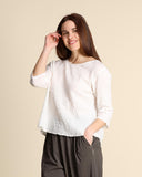 Blusa in mussola di cotone goffrata